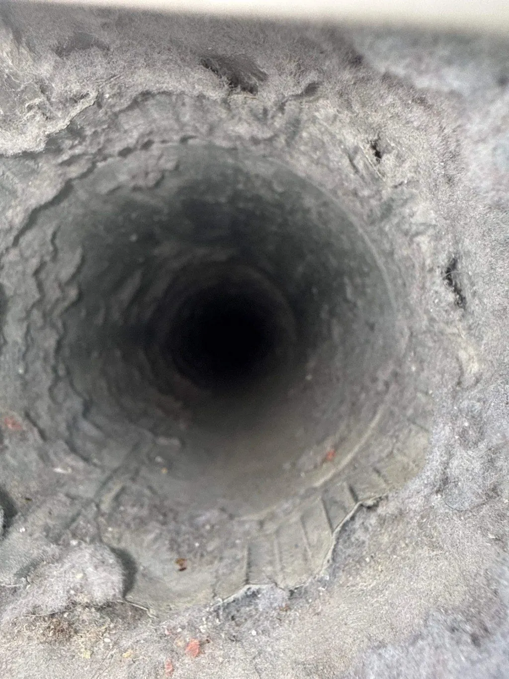 Inside a customer's ductwork before Superior's cleaning — job 8