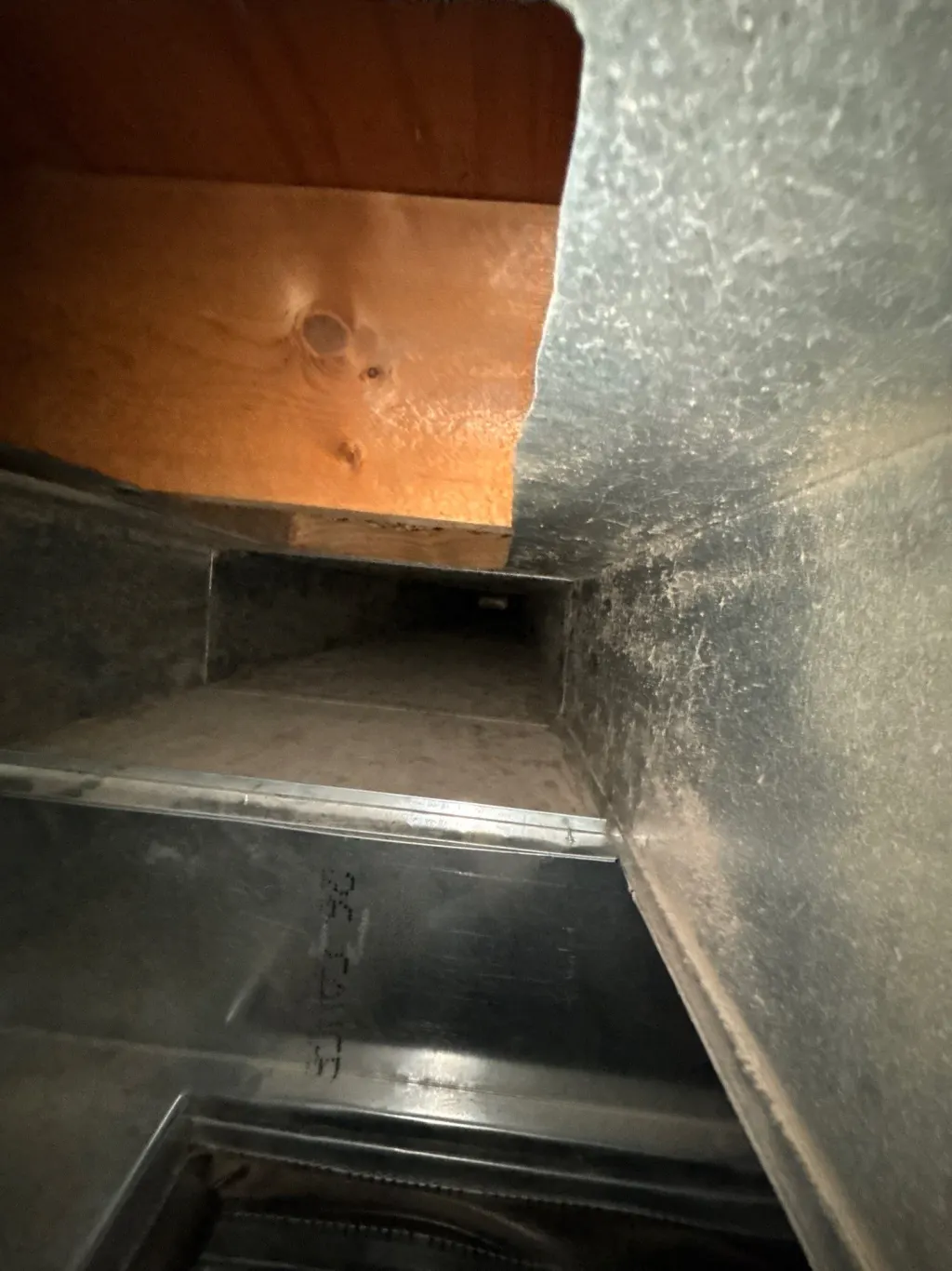 Inside a customer's ductwork before Superior's cleaning — job 23