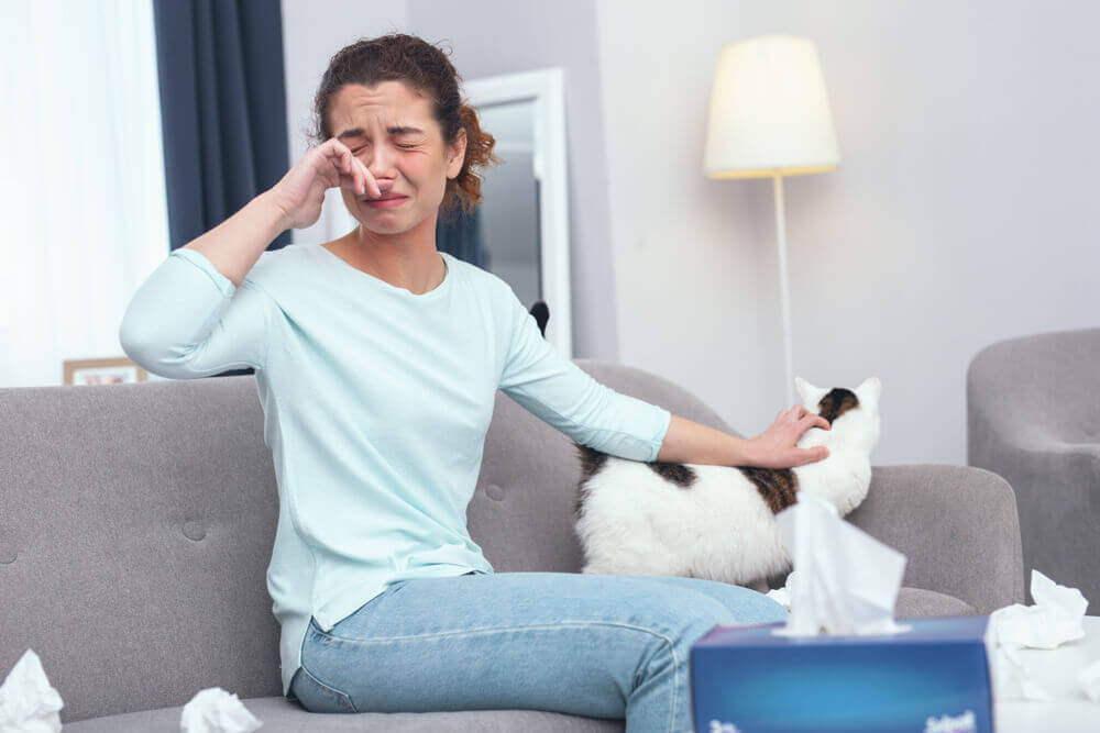 Woman experiencing pet allergies