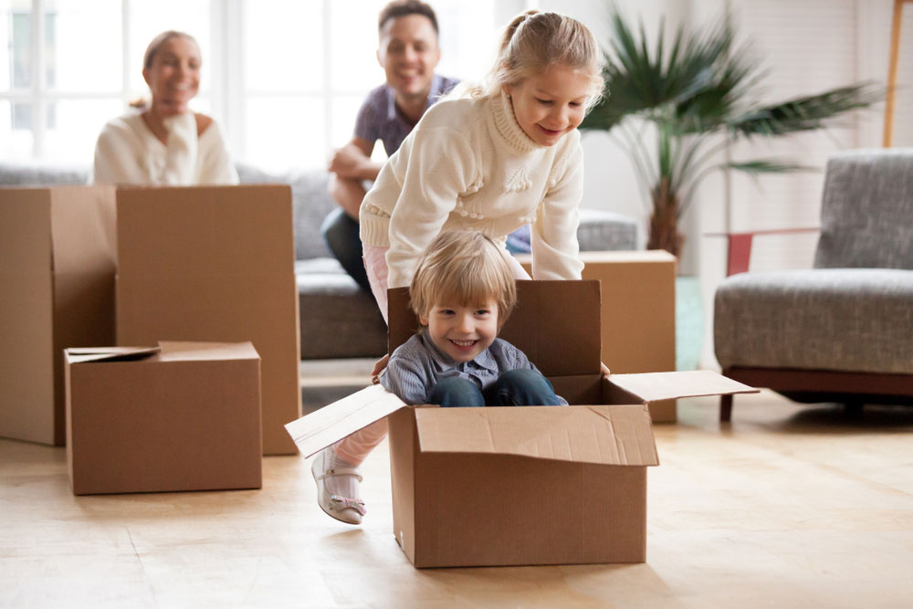 Happy family moving into a new home