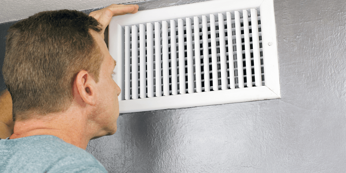 technician examining air ducts